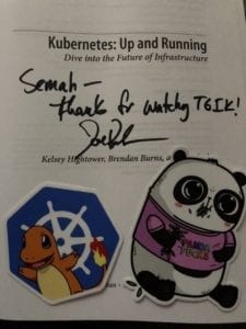 Kubernetes: Up and Running book signed by Joe Beda with sticker of Kubernetes + Charmander and Panda