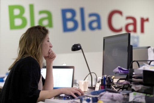 A lady working with a computer at BlaBlaCar office