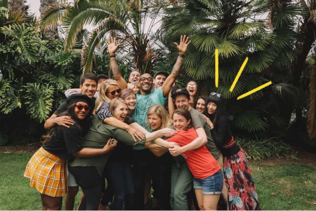 Ladieis and gentleman cheering posing in front of camera at outdoor area