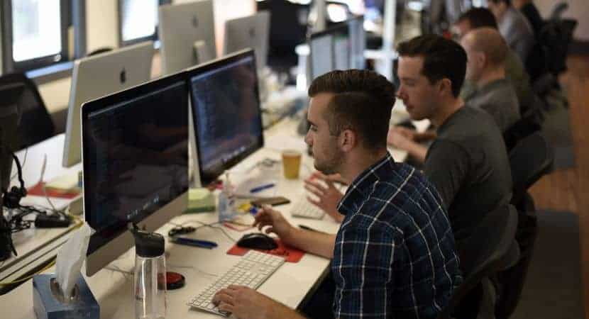 Gentlemen working on computer at the office