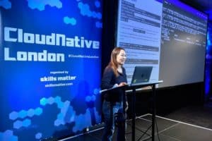 Cheryl Hung speaks at Cloud Native London on a stage