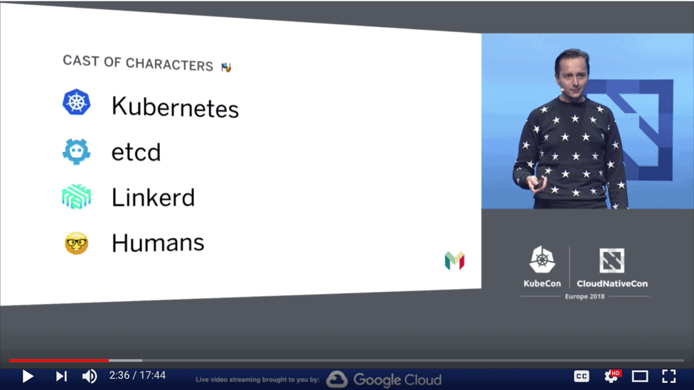 Screenshot of  video showing Oliver Beattie speaks at KubeCon + CloudNativeCon Europe 2018 about "Cast of characters"
