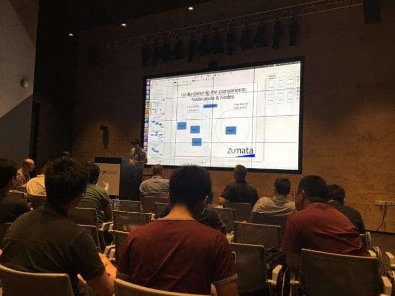 A gentlemen presenting in a room about understanding the components: node-pools & nodes by Zumata