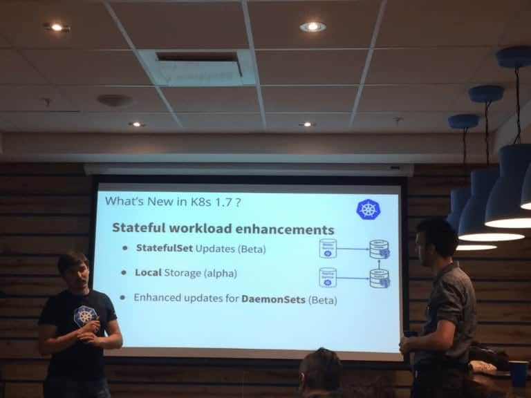 Two gentlemen presenting in a room regarding What's new in k8s 1.7