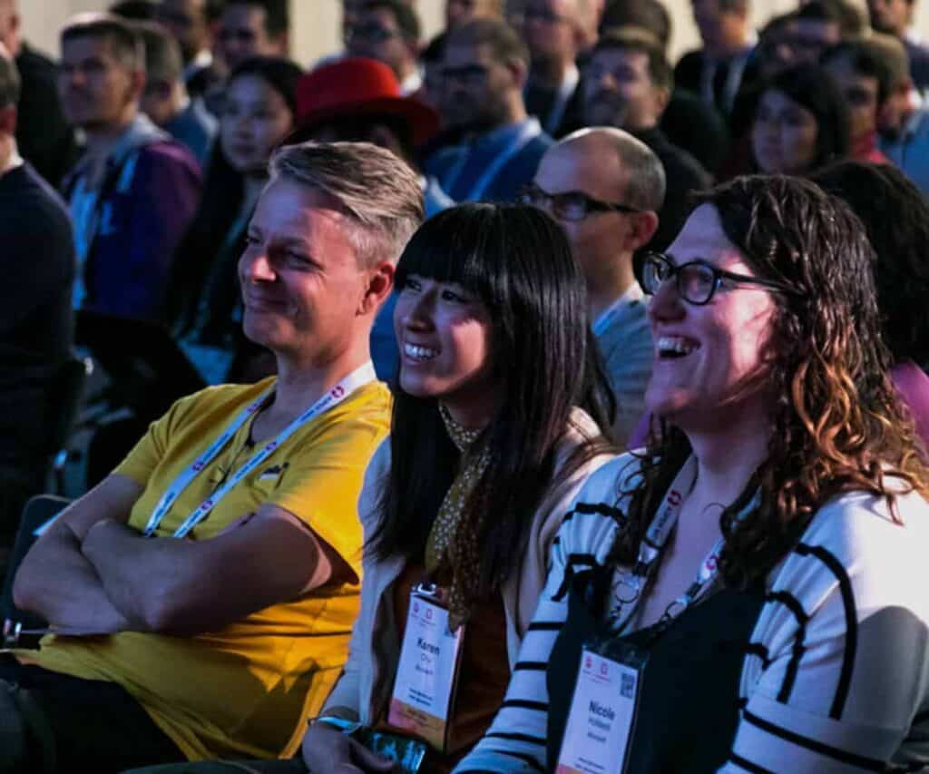 People happy at a conference