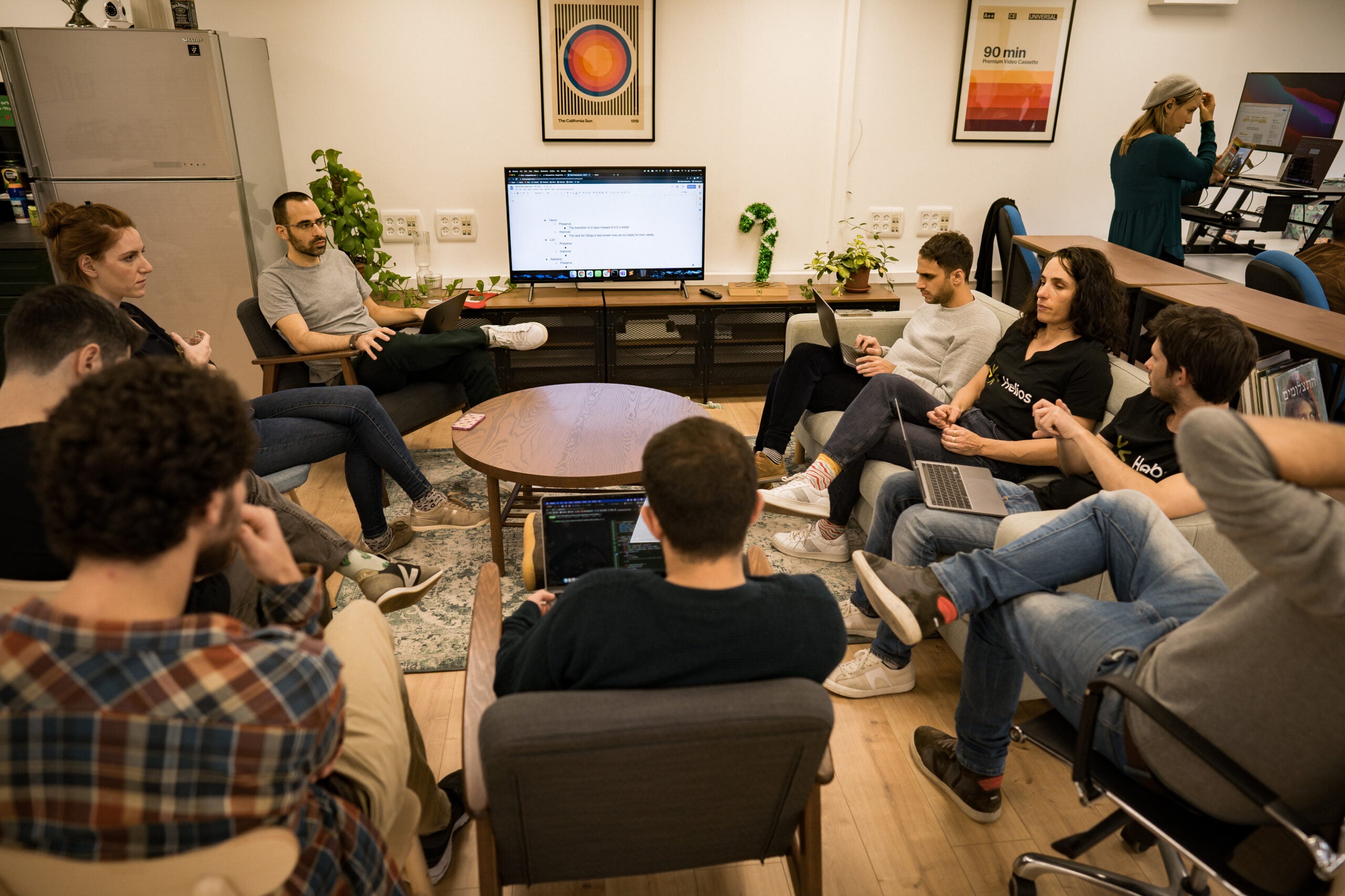 Helios team meeting around a table 