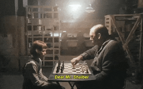 Queen of Gambit GIF showing young lady - Beth Harmon play chess towards a gentleman - Mr Shaibel