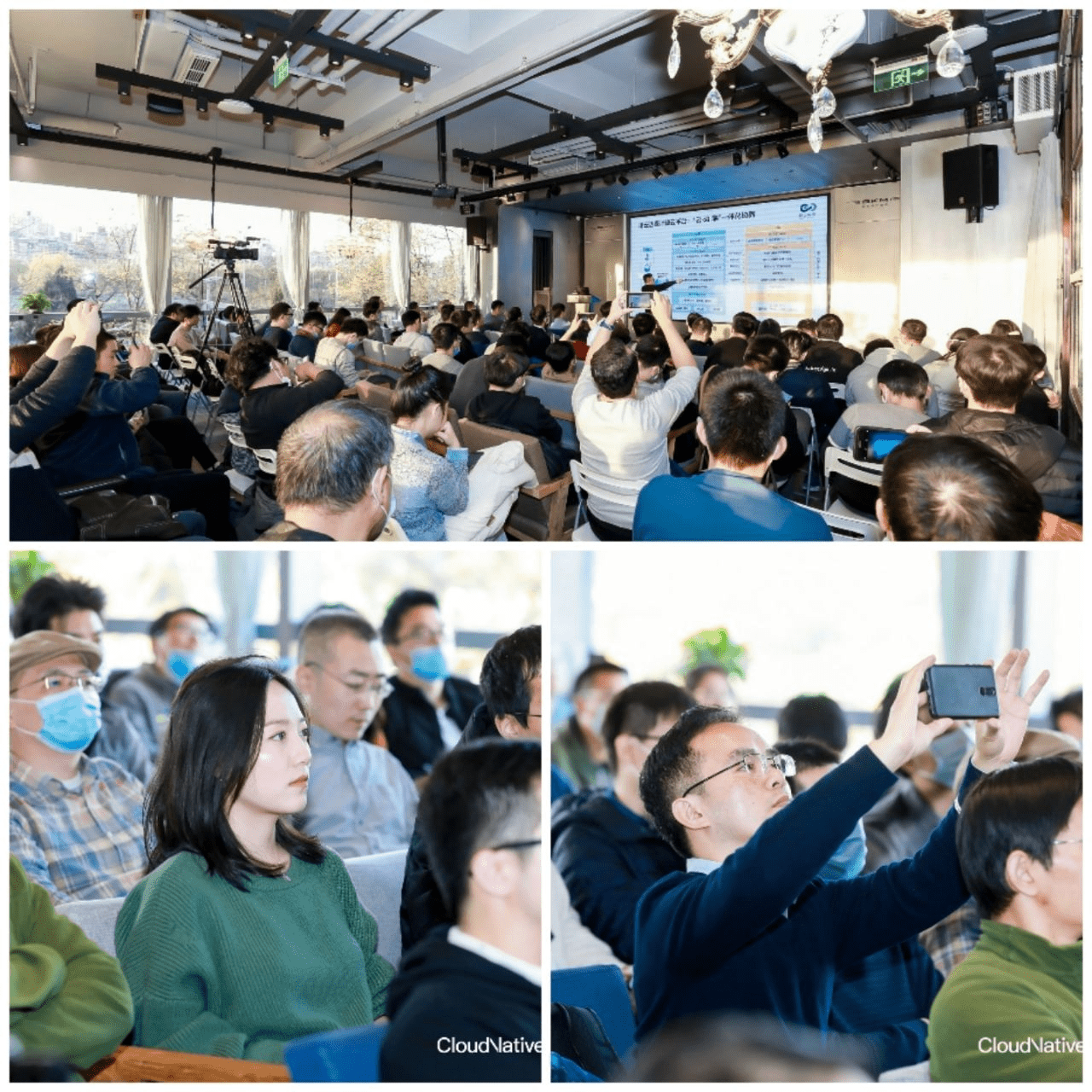 Group of participants paying attention to the presentation in a room. Some participants took picture of presentation with their mobile phone.