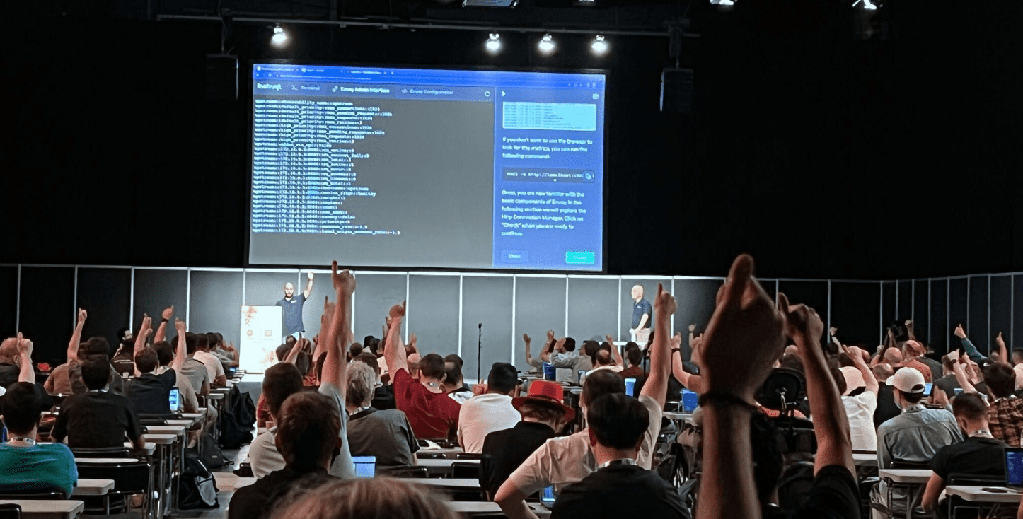 Participants in seminar hall raising thumbs