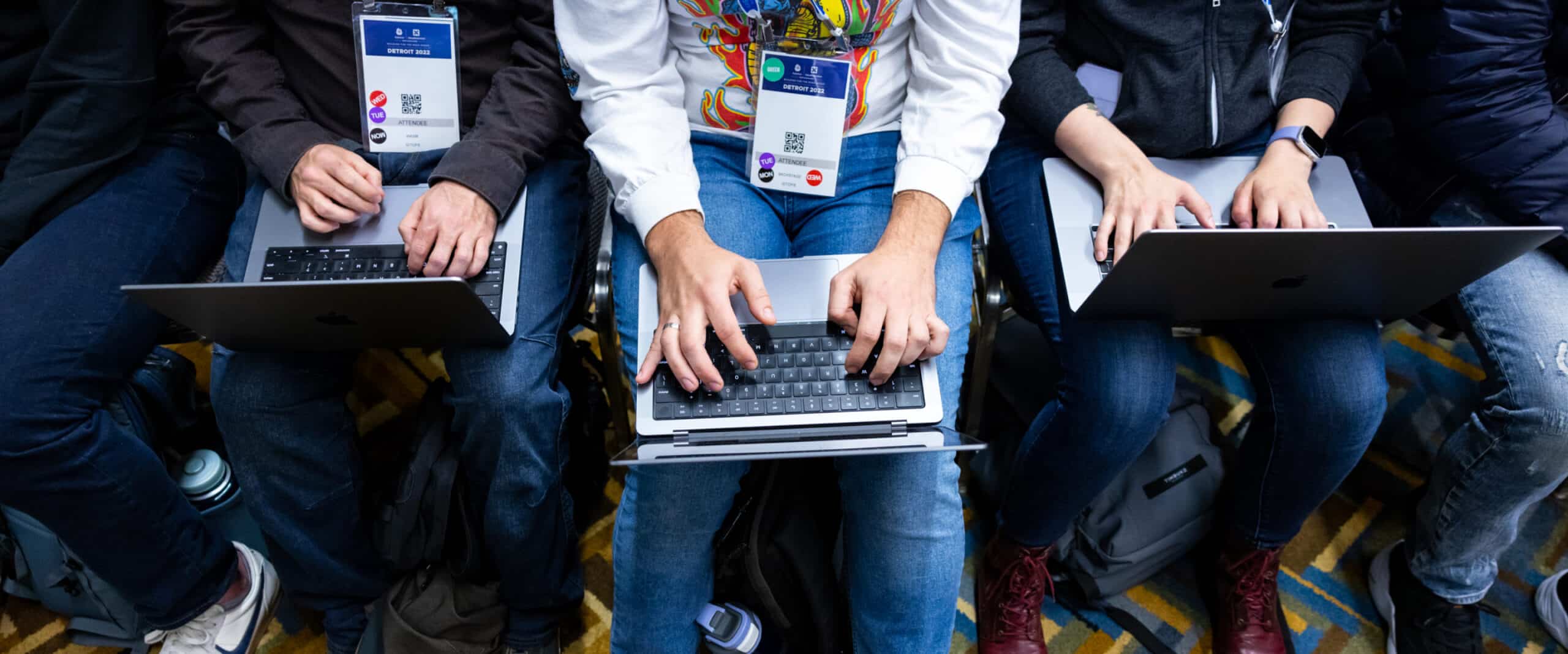 Summit participants on their laptops