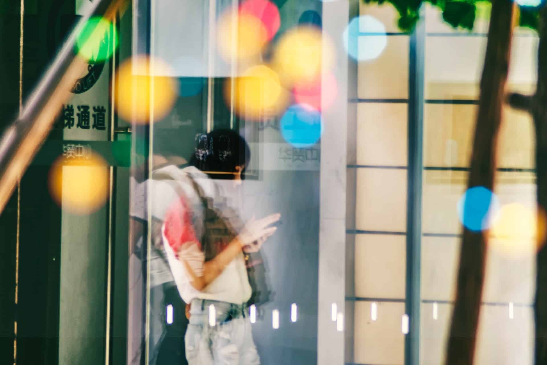 feature image for China Mobile Cloud showing woman texting on a mobile phone