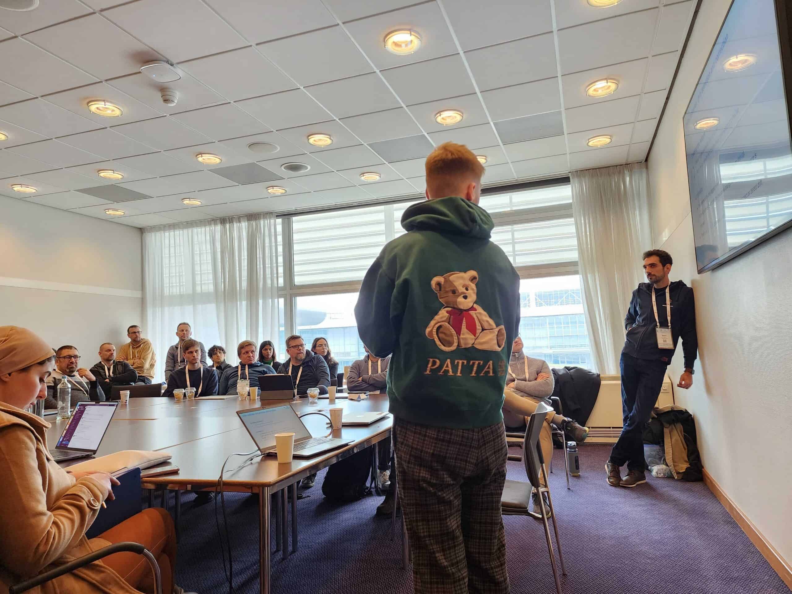 Two gentlemen giving presentation in the meeting room