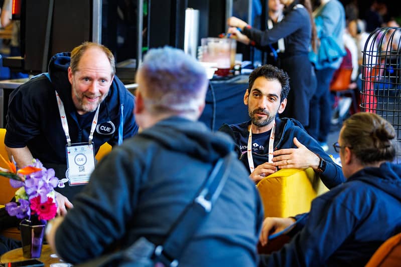 Four gentlemen having conversation in the event hall