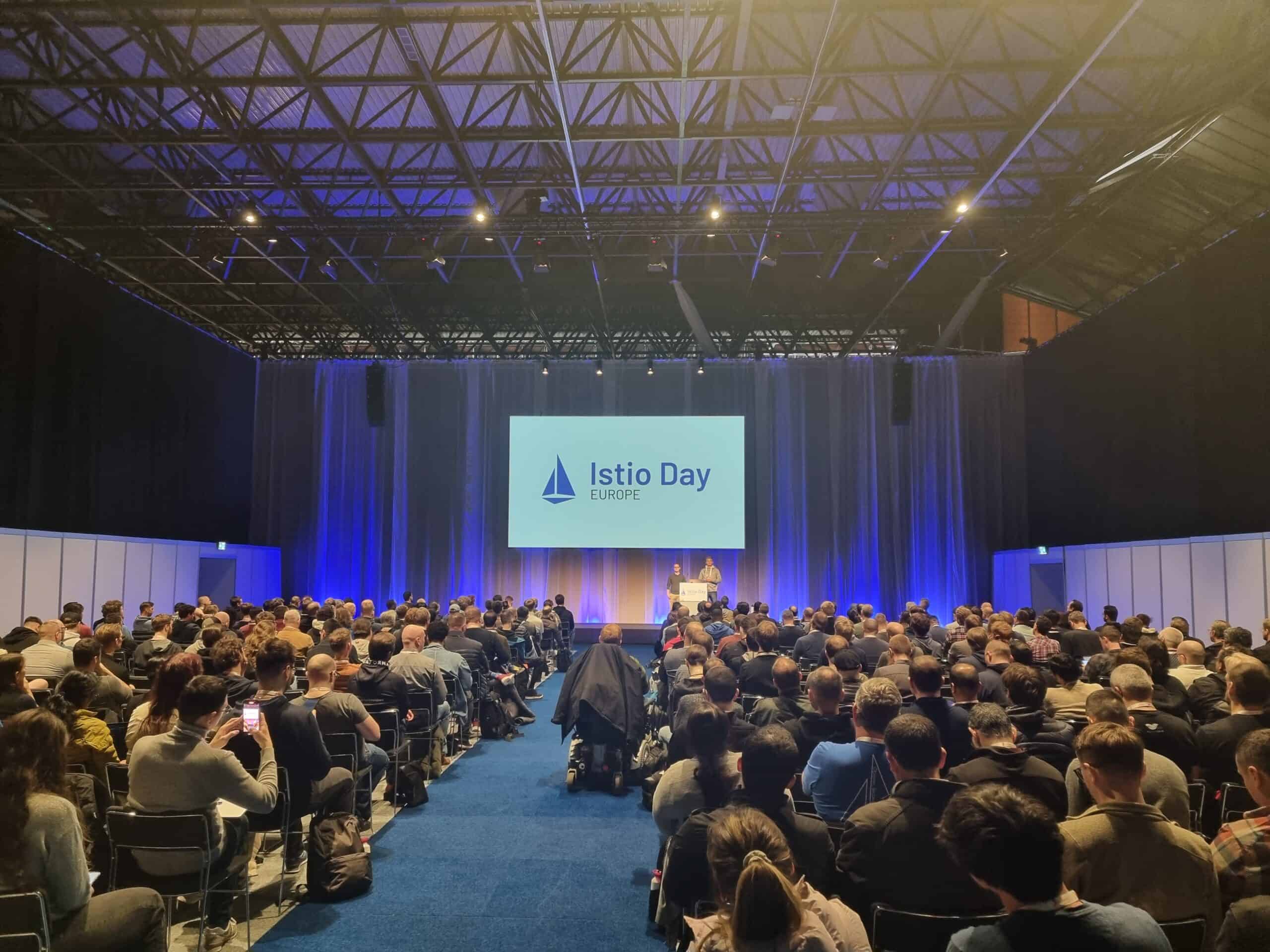 Participants sitting in Istio Day Europe event hall