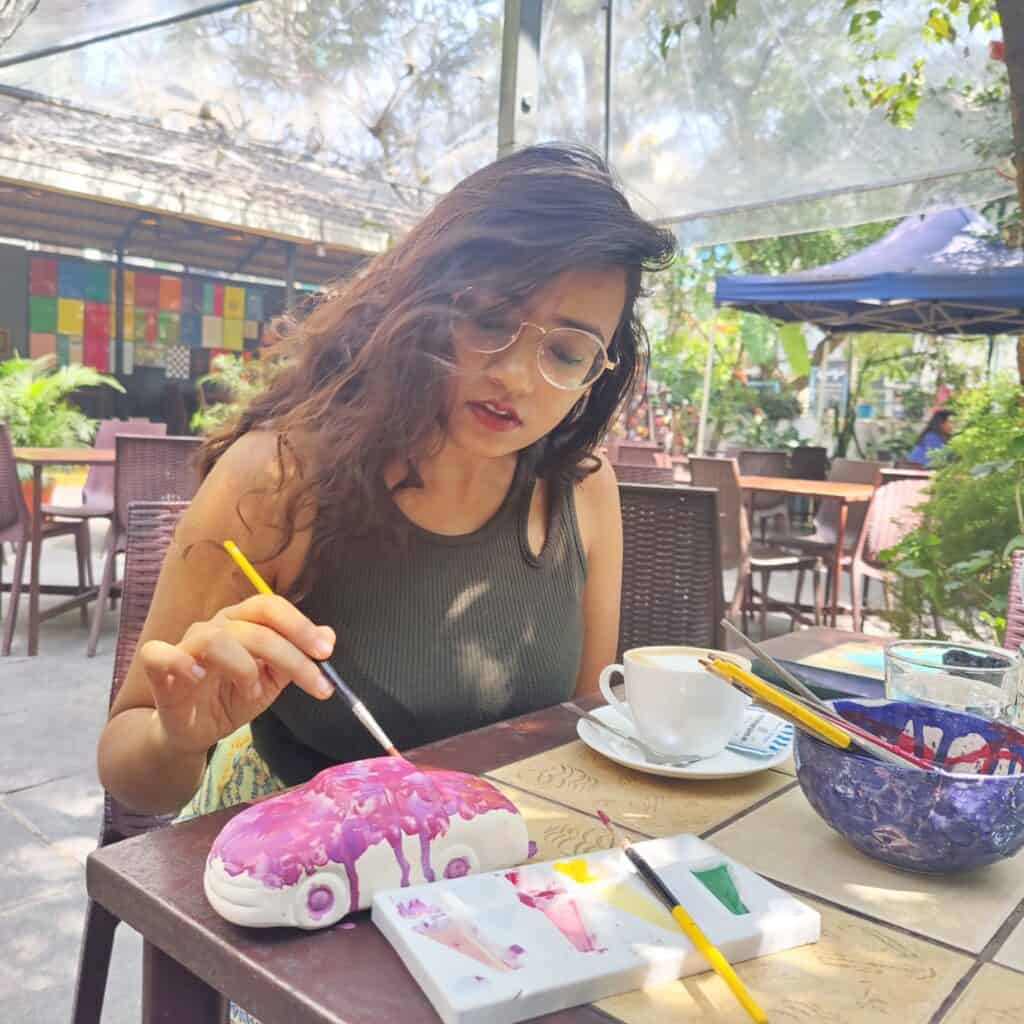 Nancy Chauhan painting pottery 