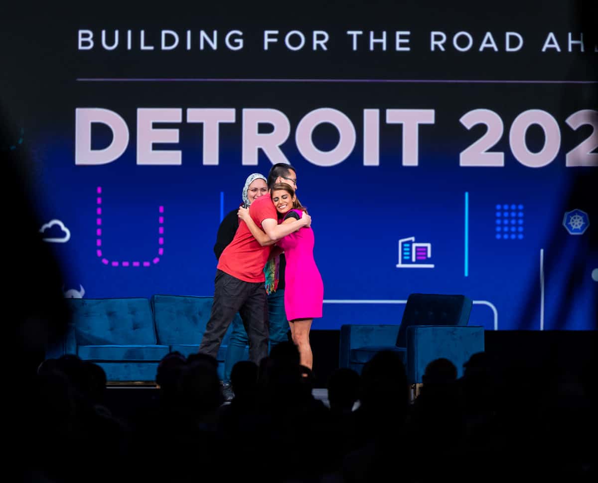 Priyanka hugging on-stage at Kubecon + CloudNativeCon Detroit