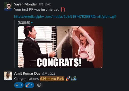 Screenshot showing Sayan Mondal writing "Your first PR was just merged" with The Office meme saying "Congrats!"