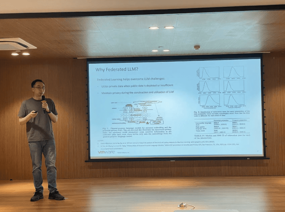 Wang Fangchi speaks on stage, presenting "Why federated LLM?"