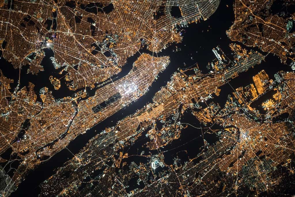 An image of Manhattan at night, shot from the atmosphere