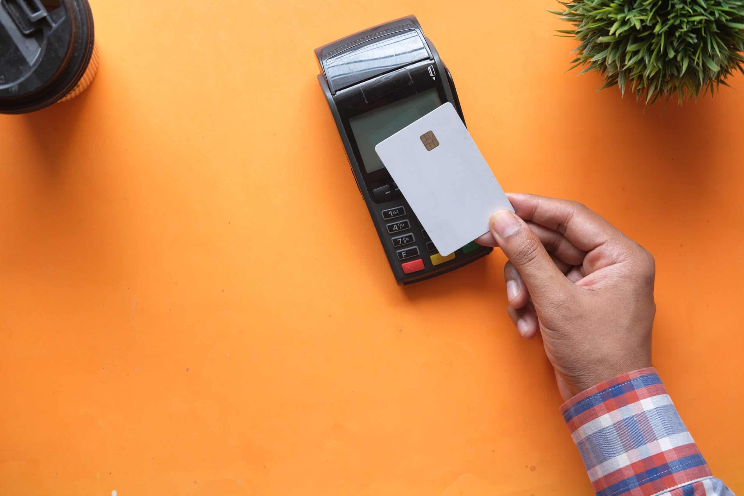 Images of person paying with tap and go payment terminal