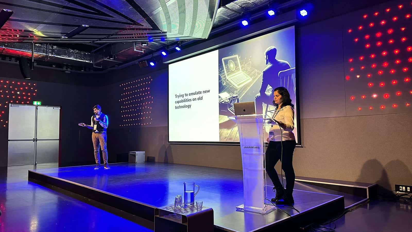 Andrea and Shweta gave talk about "Trying to emulate new capabilities on old technology" on stage
