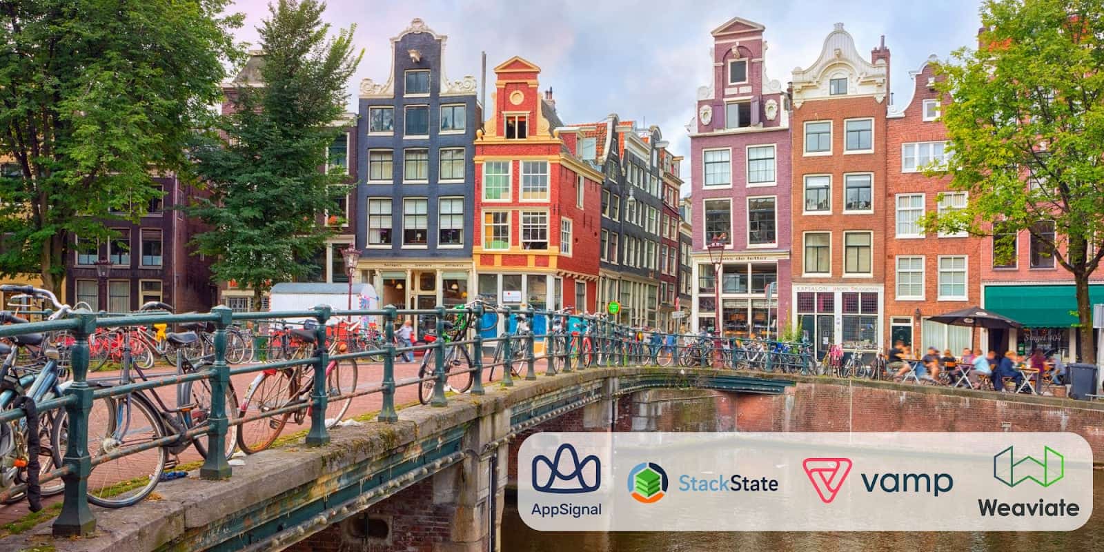 Vibrant building in Amsterdam near a bridge, surrounded by bicycles.