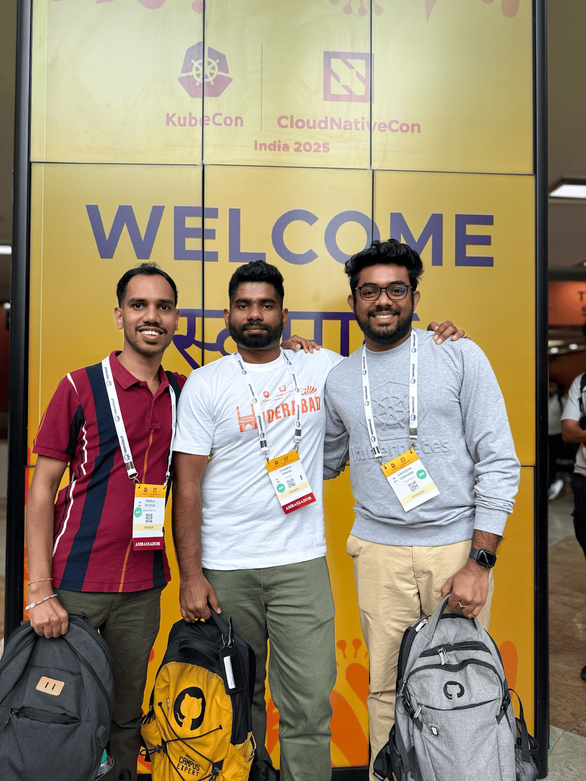 A group shot of KCD organizers Chamod, Kemila, and Kaveesha at KubeCon India 2025.