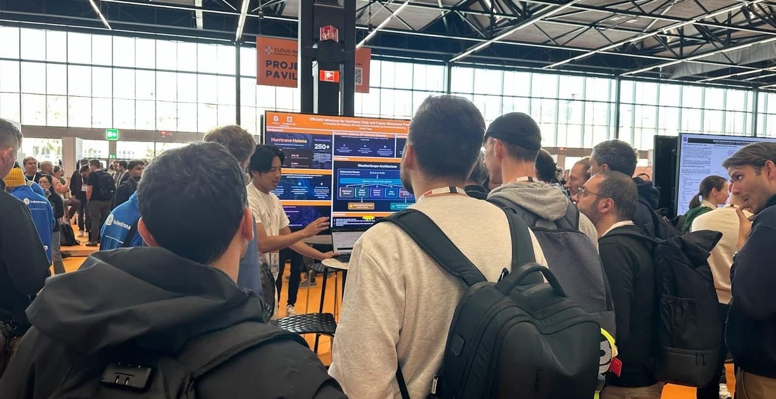 Avery Demoing Poster on Laptop